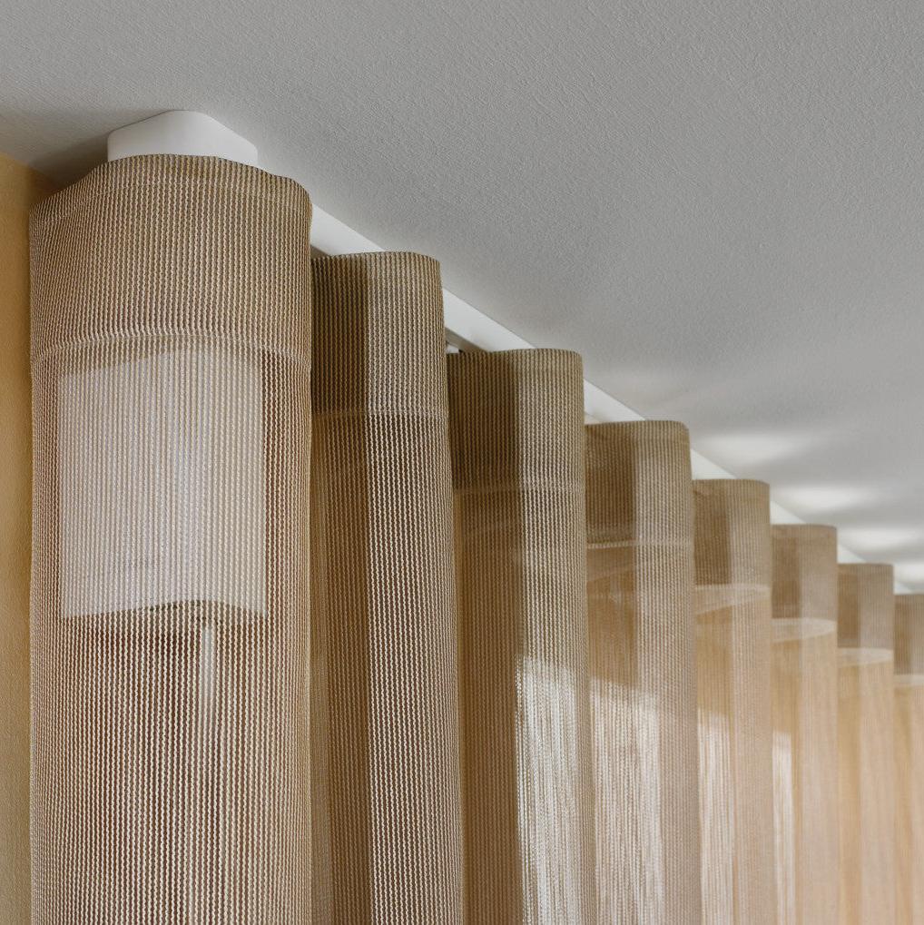 Sheer wave curtains on a ceiling-mounted electric track