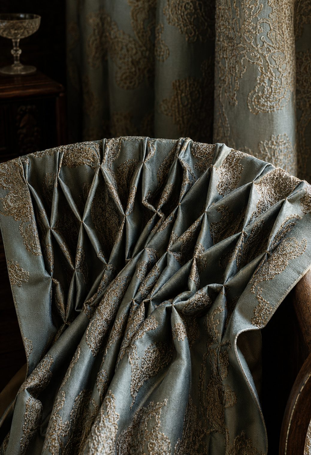 Hand-smocked pinch-pleat head in a blue-grey damask