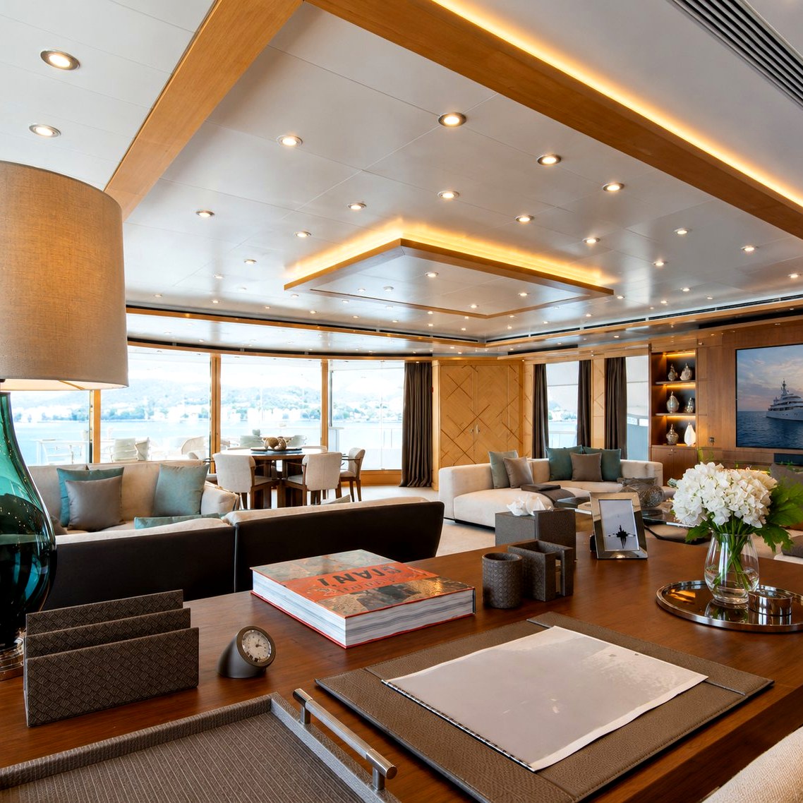Luxury yacht main saloon with editorial lighting and panoramic view