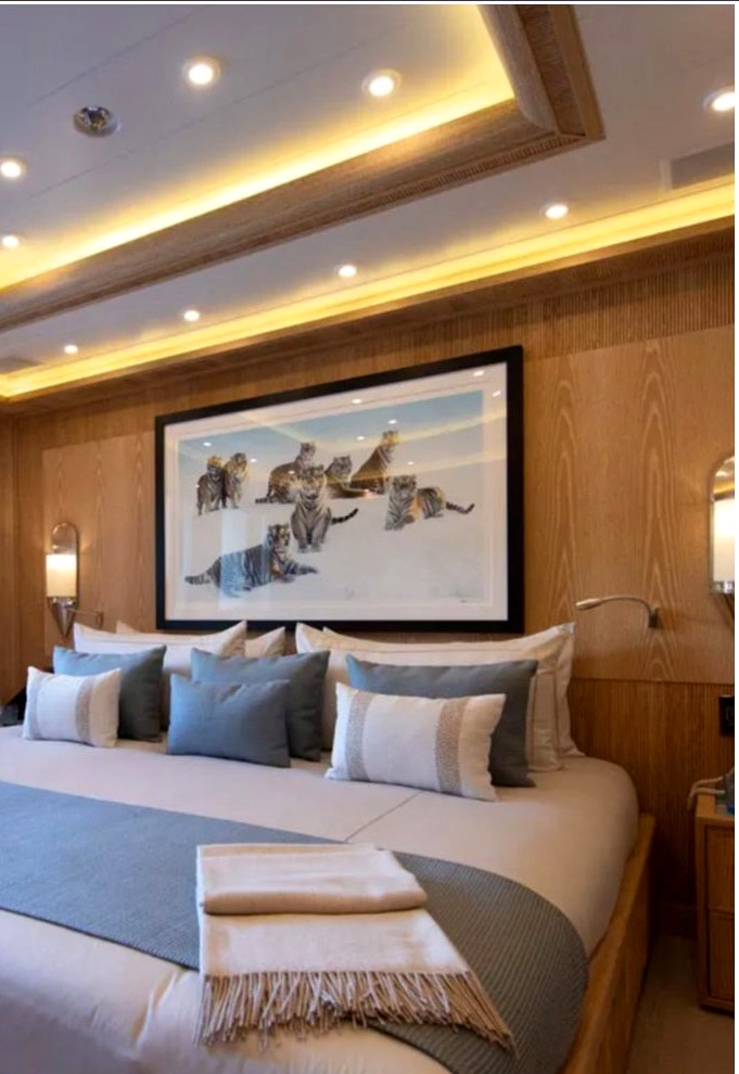 Yacht stateroom with bespoke pillows and headboard